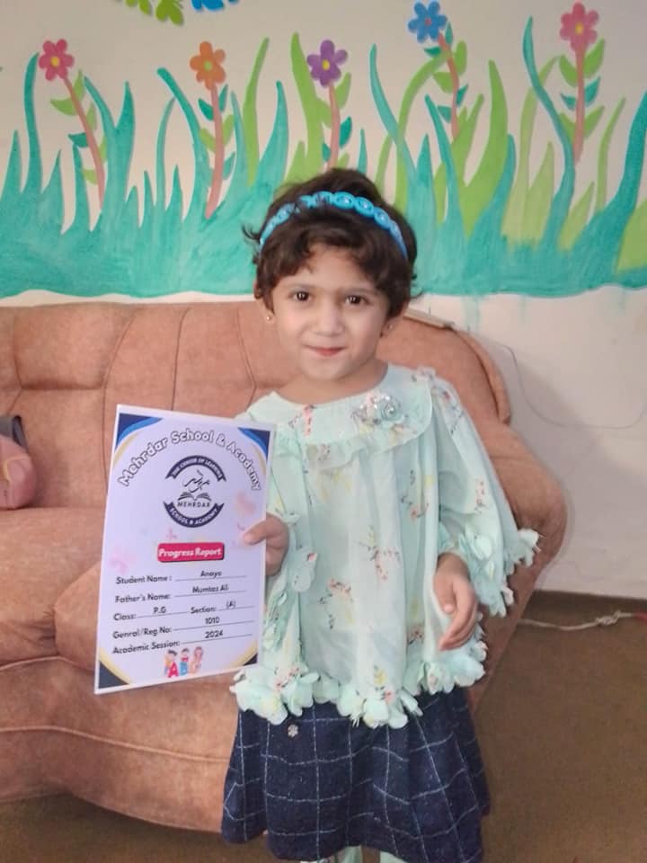 Mehrdar School student with her progress report